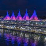 Canada place sails of light coloured in a pink and purple gradient